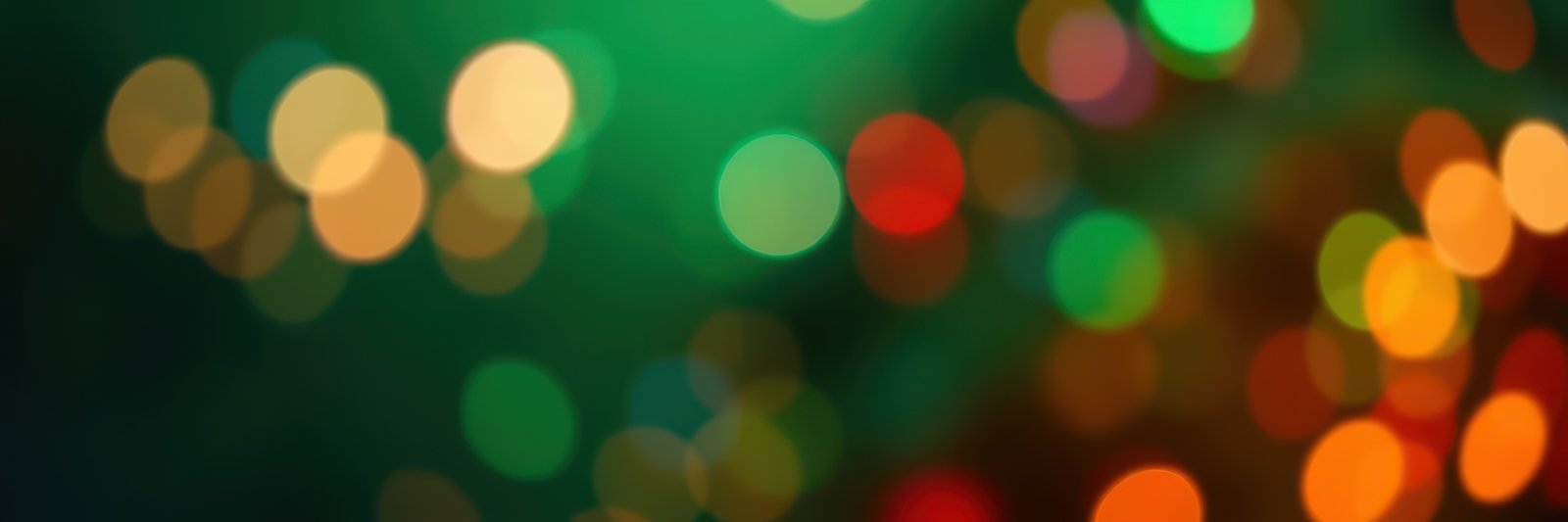 Colorful lights create a vibrant atmosphere during a festive evening celebration in a lively urban setting